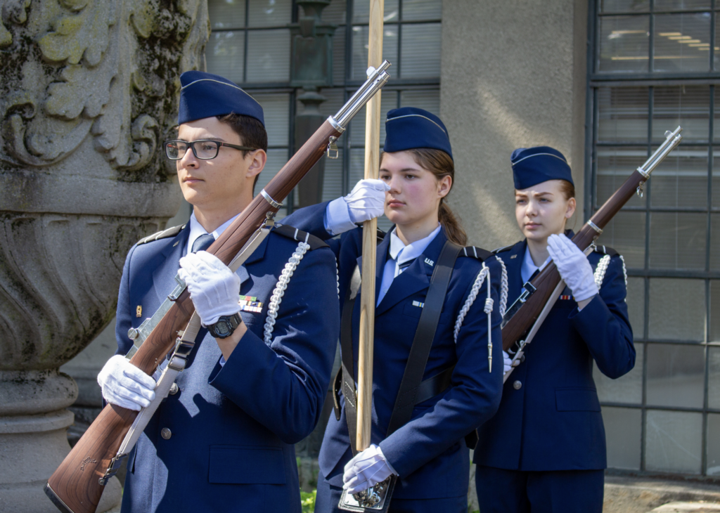 cadets holding rifles and flag