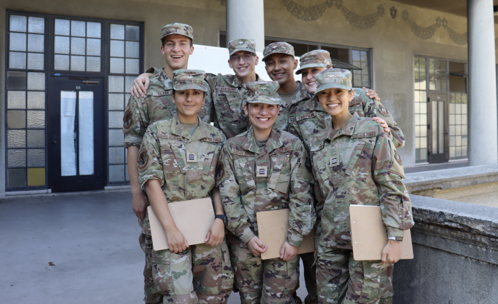 Group of cadets in uniform holding clipboards